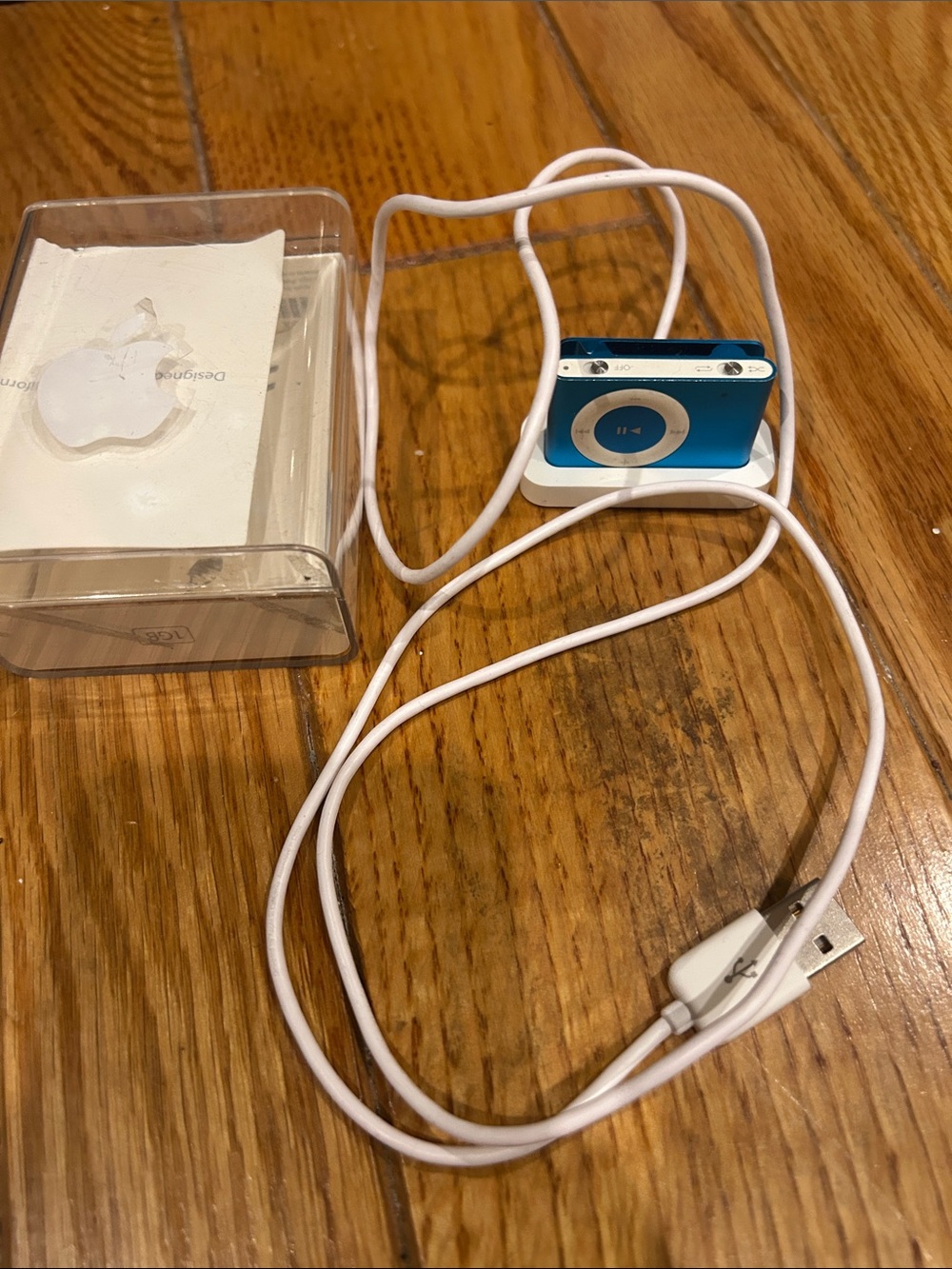 Apple Blue iPod Shuffle with White USB Charging Cable
